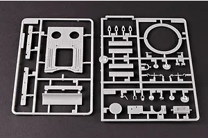 Two grey plastic model kit sprues containing various tank parts on a dark background.