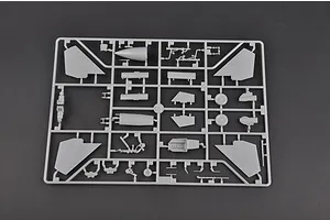 A grey plastic sprue containing various model aircraft parts for a 1/72 scale Su-27 fighter jet model kit.
