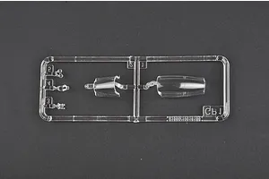 A clear plastic sprue containing the canopy and small cockpit parts for a 1/72 scale model aircraft kit.
