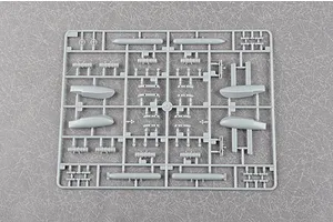 A grey plastic sprue containing various model aircraft parts, including fuel tanks and small components, for a 1/72 scale model kit.