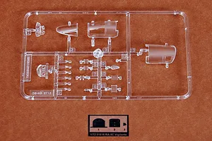 A clear plastic sprue containing canopy and cockpit parts for a 1/72 scale Trumpeter RA-5C Vigilante model kit, set against a brown background.