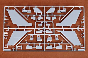 A grey plastic sprue from a Trumpeter 1/72 scale model kit containing various aircraft wing and tail components.