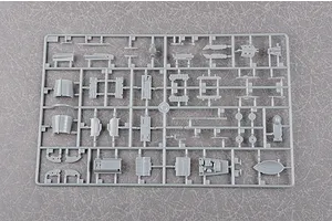 A grey plastic sprue from a Trumpeter 1/48 scale J-7G model kit featuring various aircraft parts attached to a frame.