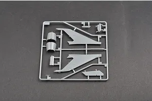 A grey plastic sprue from a Trumpeter 1/48 scale MiG-21F-13 model kit, featuring aircraft wing and fuselage components.
