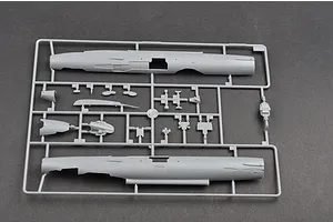 A grey plastic sprue containing fuselage halves and various small components for a 1/48 scale MiG-21F-13 model aircraft kit.