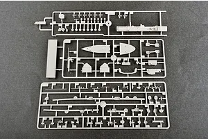 Three grey plastic model kit sprues containing various ship parts laid out on a dark grey surface.