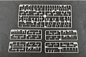 Five grey plastic model kit sprues containing small aircraft parts for a 1/700 scale model, laid out on a dark grey surface.