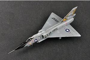 A high-angle studio shot of a fully assembled and painted 1/72 scale F-106A Delta Dart model aircraft on a dark grey surface.