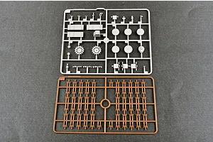 Two plastic model kit sprues on a grey background, one light grey with vehicle parts and one brown with track links.