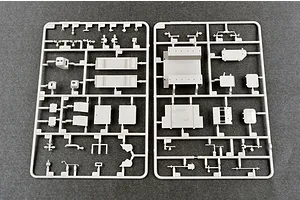 Two grey plastic model kit sprues containing various vehicle parts for the Trumpeter 1/35 Soviet AT-P Artillery Tractor model kit.