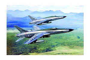 Box art illustration of two F-105 Thunderchief fighter jets flying in formation over a green landscape with mountains in the distance.