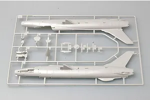 A grey plastic model kit sprue containing fuselage halves and cockpit components for a 1/72 scale F-105 Thunderchief model.