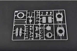 A grey plastic sprue containing various parts for a 1/35 scale model kit, including turret components and hatches.