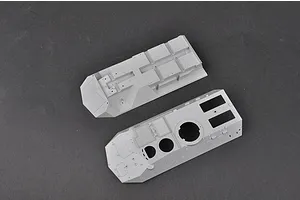 Two unpainted grey plastic model kit parts for the Trumpeter 1/35 Canadian Grizzly AVGP, showing the upper and lower hull sections.