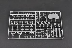 A grey plastic sprue containing various small model parts for a 1/35 scale military vehicle kit, set against a dark grey background.