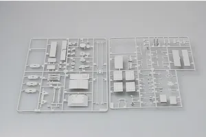 Two grey plastic model kit sprues containing various vehicle parts for a 1/35 scale military truck model.