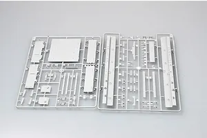 Two grey plastic model kit sprues containing various flat panels and structural components for a 1/35 scale military vehicle model.