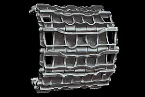 A section of assembled 1/35 scale plastic tank tracks with a metallic grey finish against a black background.