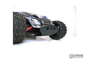 A T-Bone Racing front bumper installed on a Traxxas 1/16 E-Revo RC car, viewed from a low front angle.