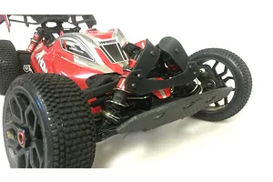 A close-up view of the front end of a red ARRMA Typhon RC buggy, showing the T-Bone Racing black shock tower skid plates installed.