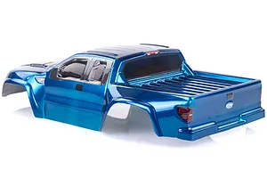 A blue pre-painted RC short course truck body shell viewed from the rear three-quarter angle on a white background.