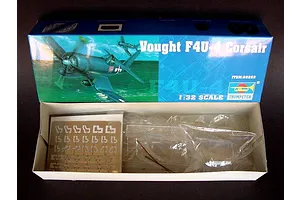 Open box of the Trumpeter 1/32 scale Vought F4U-4 Corsair plastic model kit showing box art and internal parts in plastic bags.
