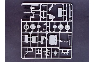 A grey plastic sprue containing various unpainted model aircraft parts for a Trumpeter 1/32 Vought F4U-4 Corsair kit.