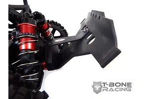 A close-up view of a black T-Bone Racing front bumper installed on an ARRMA RC vehicle, showing the shock absorbers and chassis details.