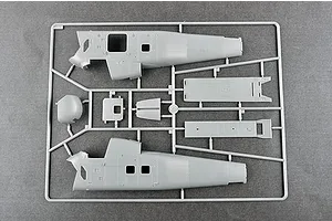A grey plastic model kit sprue containing fuselage halves and interior panels for a 1/48 scale H-34 helicopter model.