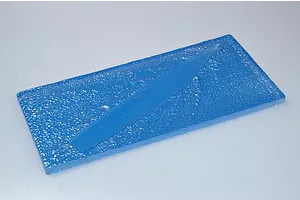 A blue plastic display base representing water for a 1/700 scale model ship kit.