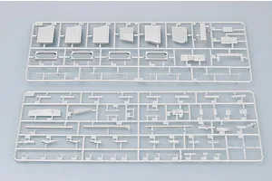 Two grey plastic model kit sprues containing various ship parts laid out on a light grey background.