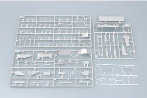 Three grey plastic model kit sprues and one clear plastic sprue for a 1/700 scale model ship on a light grey background.