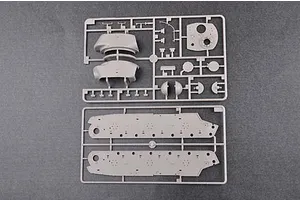 Two grey plastic model kit sprues containing tank hull and turret parts on a dark grey background.