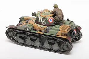 A 1/35 scale Tamiya French R35 tank model kit, fully assembled and painted in a camouflage pattern with a tank commander figure in the turret.