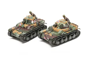 Two assembled and painted 1/35 scale Tamiya French R35 tank models with crew figures, featuring camouflage paint schemes on a white background.