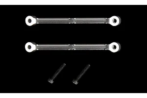 Two silver aluminium RC shock tower braces and two black metal screws against a black background.