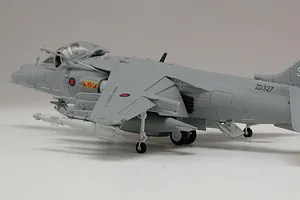 A side-angle view of a completed 1/72 scale Airfix Harrier GR9 plastic model aircraft, painted in grey with RAF markings.