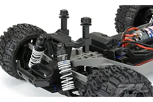 Pro-Line extended body mounts installed on the rear of a Traxxas Rustler 4x4 RC vehicle chassis.