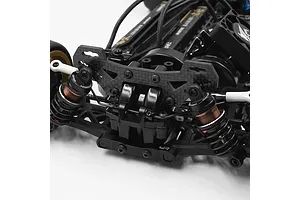 Close-up of a carbon fibre rear shock tower installed on a Tamiya TT-02 RC chassis, featuring adjustable shock absorbers.