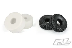Two Pro-Line 2.2 inch Trencher rock crawler tyres and two white foam tyre inserts on a white background.