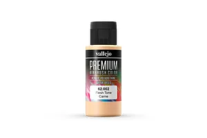 A bottle of Vallejo Premium Airbrush Color paint in Flesh Tone, showing the black cap and label with product details on a white background.