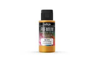 A 60ml bottle of Vallejo Premium Airbrush Color paint in Yellow Ochre, featuring a black cap and a label with product details.