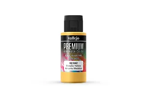 A 60ml bottle of Vallejo Premium Metallic Yellow airbrush paint with a black cap against a white background.