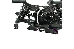 Yeah Racing Momentum aluminium droop gauge support blocks in black and purple installed under an RC car chassis.