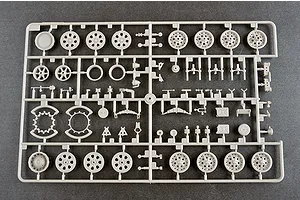 A grey plastic model kit sprue containing various wheels, suspension components, and small parts for a 1/35 scale military vehicle model.