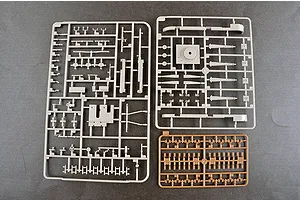 Three plastic model kit sprues containing various grey and tan parts for a 1/35 scale military vehicle model.