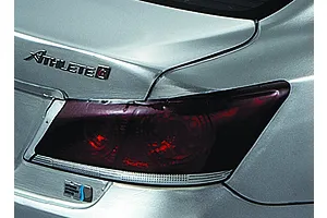 Close-up of the rear taillight and trunk emblem on a silver 1/10 scale RC Toyota Crown Athlete model car.