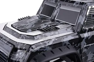 Close-up of a camouflage RC truck body showing the installed black front air intake covers on the hood.