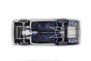 Bottom view of a 1/24 scale Revell 1966 Malibu SS model car showing the chassis, drivetrain, exhaust, and suspension details.