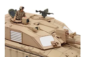 Close-up of a painted 1/48 scale Tamiya Challenger 2 tank model showing the turret, commander figure, and desert camouflage paint scheme.